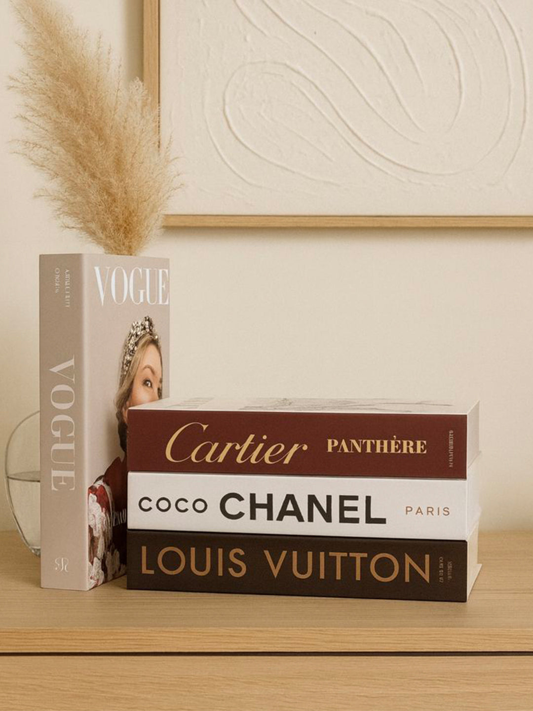 Decorative fashion books on wooden console